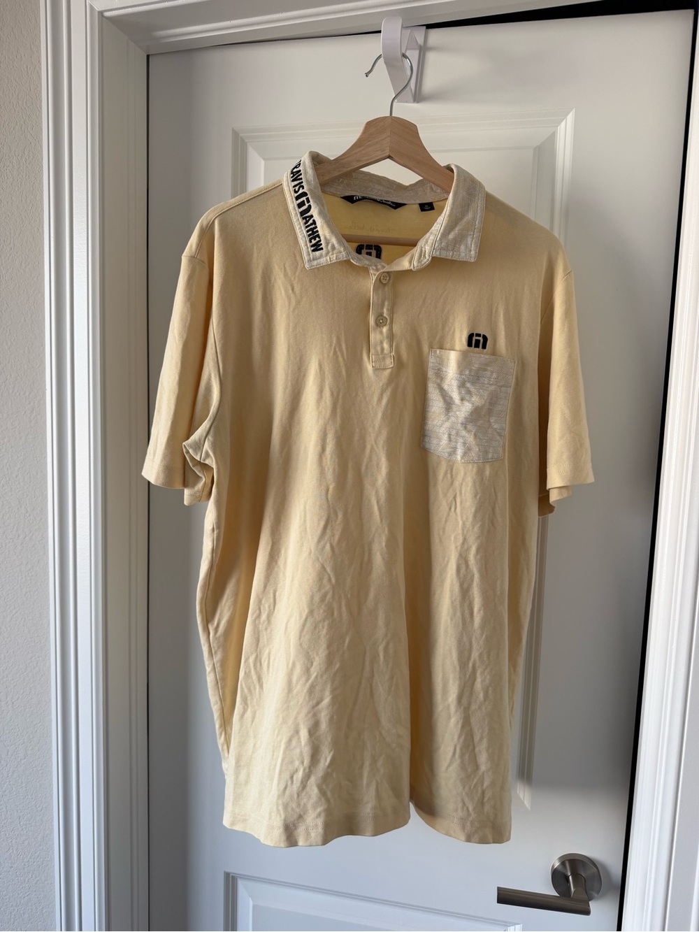 Travis Mathew Cream Polo with Contrast Pocket